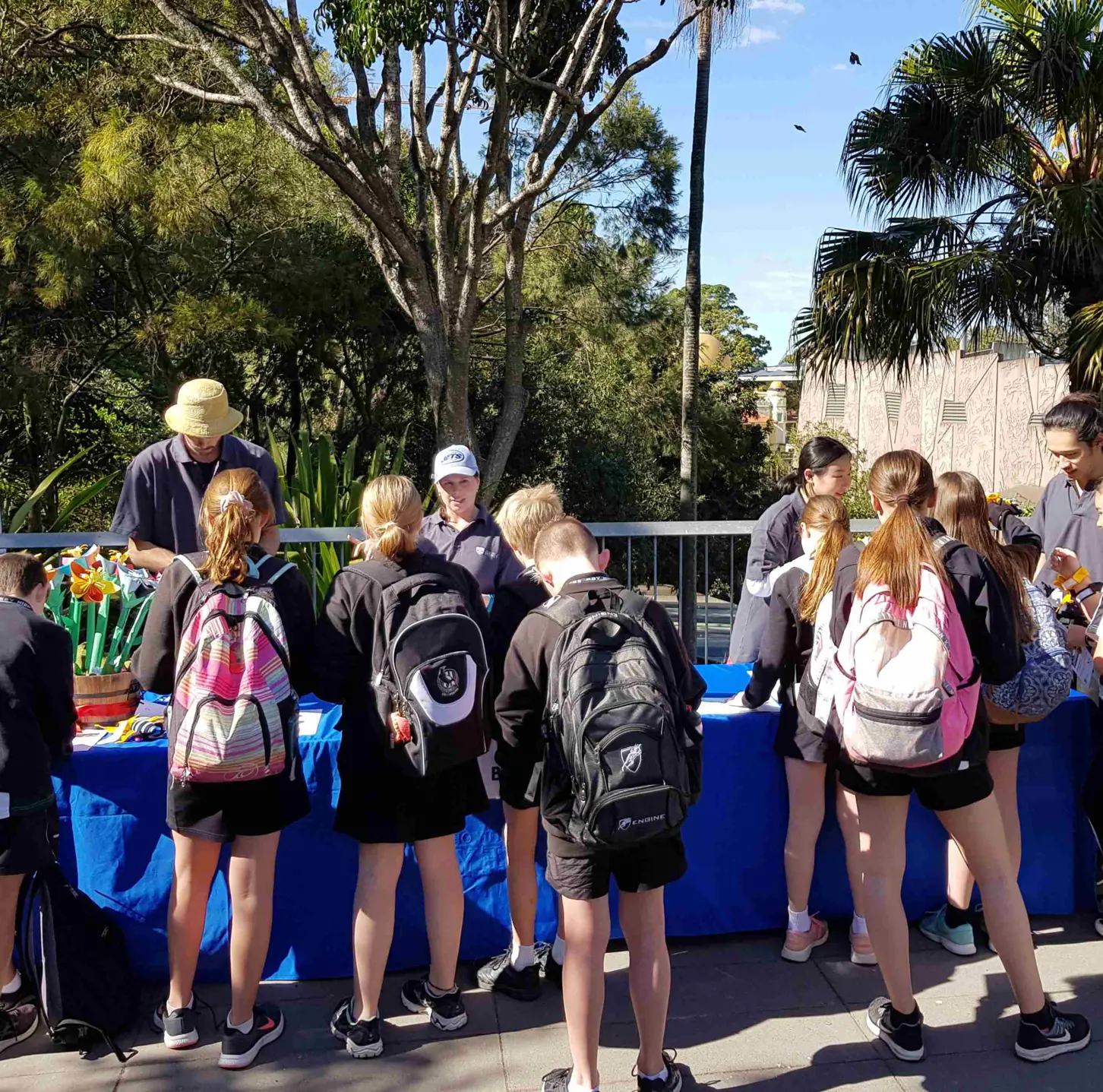 School students participating in an outdoor learning activity during National Science Week at a zoo.
