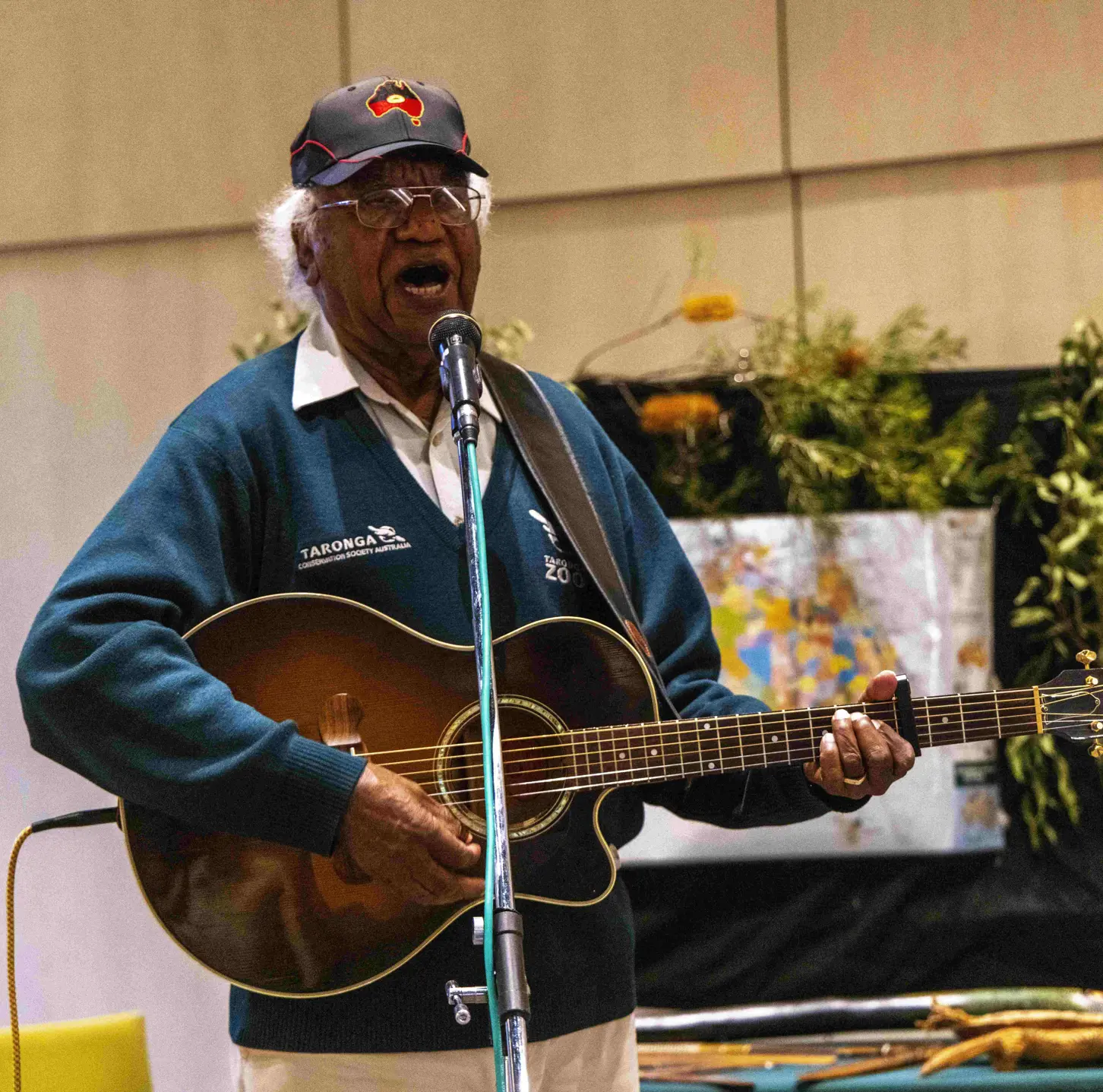 Educator presenting an Animals of the Dreaming storytelling session using music as part of an education program.